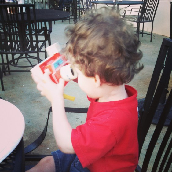 Avett taking pictures with the toy camera. 